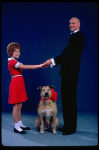 Kathleen Sisk as Annie and Gary Holcombe as Daddy Warbucks w. Sandy in a scene from a touring company of the musical "Annie." (Atlanta)
