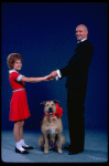 Kathleen Sisk as Annie and Gary Holcombe as Daddy Warbucks w. Sandy in a scene from a touring company of the musical "Annie." (Atlanta)