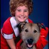 Kathleen Sisk as Annie w. Sandy in a scene from a touring company of the musical "Annie." (Atlanta)