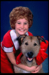 Kathleen Sisk as Annie w. Sandy in a scene from a touring company of the musical "Annie." (Atlanta)