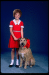 Kathleen Sisk as Annie w. Sandy in a scene from a touring company of the musical "Annie." (Atlanta)