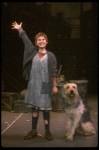 Kathleen Sisk as Annie w. Sandy in a scene from a touring company of the musical "Annie." (Atlanta)