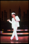 Actress Liza Minnelli wearing a white suit w. a fedora designed by Halston in a scene from the Broadway production of the musical "The Act." (New York)