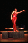 Actress Liza Minnelli in a red-sequined pant suit designed by Halston in a scene from the Broadway production of the musical "The Act." (New York)