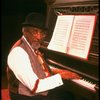 Musical director Luther Henderson at the piano in a scene from the Broadway revival of the musical "Ain't Misbehavin'." (New York)