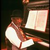 Musical director Luther Henderson at the piano in a scene from the Broadway revival of the musical "Ain't Misbehavin'." (New York)