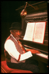 Musical director Luther Henderson at the piano in a scene from the Broadway revival of the musical "Ain't Misbehavin'." (New York)