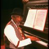 Musical director Luther Henderson at the piano in a scene from the Broadway revival of the musical "Ain't Misbehavin'." (New York)