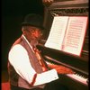 Musical director Luther Henderson at the piano in a scene from the Broadway revival of the musical "Ain't Misbehavin'." (New York)