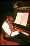 Musical director Luther Henderson at the piano in a scene from the Broadway revival of the musical "Ain't Misbehavin'." (New York)