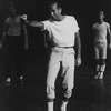 Choreographer Jerome Robbins, in white t-shirt and socks, khakis, and tennis shoes, directing a rehearsal of "West Side Story".