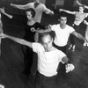Choreographer Jerome Robbins, in white t-shirt directing male and female chorus members during a rehearsal of "West Side Story".