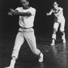 Choreographer Jerome Robbins, in white t-shirt, khakis and tennis shoes directing a male chorus member during a rehearsal of "West Side Story".
