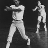 Choreographer Jerome Robbins, in white t-shirt, khakis and tennis shoes directing a male chorus member during a rehearsal of "West Side Story".