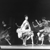 Actress Chita Rivera dancing with female chorus members in musical "West Side Story".