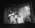 Carol Lawrence and Larry Kert hugging while performing in Maria's bedroom scene in musical "West Side Story".