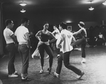 Chita Rivera and unidentified chorus members during rehearsals for stage production West Side Story