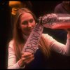 Meryl Streep (as Alice) holding a bottle that says "Drink Me" in a scene from the NY Shakespeare Festival production of the musical "Alice." (New York)