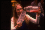 Meryl Streep (as Alice) holding a bottle that says "Drink Me" in a scene from the NY Shakespeare Festival production of the musical "Alice." (New York)