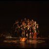 Cats singing near a large boot in a scene from the Broadway musical "Cats." (New York)