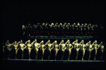 Dancers in gold performing "One" in a scene from the Broadway musical "A Chorus Line." (New York)