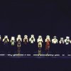 Dancers holding their resume photos in front of their faces while performing "I Hope I Get It" in a scene from the Broadway musical "A Chorus Line." (New York)