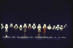 Dancers holding their resume photos in front of their faces while performing "I Hope I Get It" in a scene from the Broadway musical "A Chorus Line." (New York)