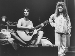 Actors Bernadette Peters and Martin Short (naked while playing guitar) in a scene from the Broadway production of the musical "The Goodbye Girl".