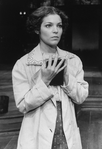 Actress Amy Irving clutching a book in a scene from the Circle In The Square production of the play "Heartbreak House".