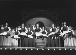 Dancing waiters aloft in a scene from the revival tour of the Broadway production of the musical "Hello, Dolly!"