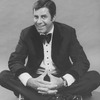 Comic Jerry Lewis sitting crosslegged in a promo shot for the pre-Broadway tour of the musical revue "Hellzapoppin".