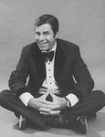 Comic Jerry Lewis sitting crosslegged in a promo shot for the pre-Broadway tour of the musical revue "Hellzapoppin".