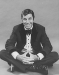 Comic Jerry Lewis sitting crosslegged in a promo shot for the pre-Broadway tour of the musical revue "Hellzapoppin".