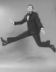 Comic Jerry Lewis mugging while flying in a promo shot for the pre-Broadway tour of the musical revue "Hellzapoppin".