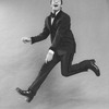 Comic Jerry Lewis mugging while flying in a promo shot for the pre-Broadway tour of the musical revue "Hellzapoppin".