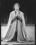 Actor Kevin Kline kneeling in prayer in a scene from the NY Shakespeare Festival Central Park production of the play "Henry V"