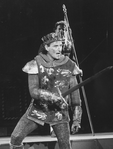 Actor Kevin Kline wielding a sword in a scene from the NY Shakespeare Festival Central Park production of the play "Henry V"