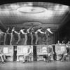 Actress Jane Powell (4L) dancing atop a piano in a scene from the Broadway production of the musical "Irene"