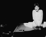 Leslie Uggams singing atop a piano in a scene from the Broadway production of the musical "Jerry's Girls"