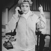 Angela Lansbury talking on the phone in a scene from the Broadway production of the play "A Little Family Business"