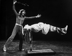 Magician Doug Henning levitating a woman in a scene from the Broadway production of the musical "The Magic Show"