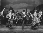 Judy Kuhn (2L), Donna Murphy (3L) and George Rose (C) dancing in a scene from the Broadway production of the musical "The Mystery Of Edwin Drood".