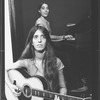 Composer Elizabeth Swados playing guitar (B) in a scene from the off-Broadway production of the musical "Nightclub Cantata"