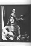 Composer Elizabeth Swados playing guitar (B) in a scene from the off-Broadway production of the musical "Nightclub Cantata"