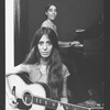 Composer Elizabeth Swados playing guitar (B) in a scene from the off-Broadway production of the musical "Nightclub Cantata"