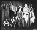 Ron Moody (2R) in a scene from the Broadway revival of the musical "Oliver".