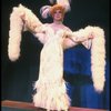 George Hearn in drag in a white costume w. a feather boa in a scene from the Broadway musical "La Cage Aux Folles." (New York)
