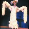 George Hearn in drag in a white costume w. a feather boa in a scene from the Broadway musical "La Cage Aux Folles." (New York)