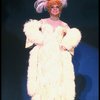 George Hearn in drag in a white costume w. a feather boa in a scene from the Broadway musical "La Cage Aux Folles." (New York)