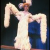 George Hearn in drag in a white costume w. a feather boa in a scene from the Broadway musical "La Cage Aux Folles." (New York)